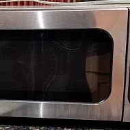 Микроволновая печь Sharp мощностью 1100 Вт, модель R-305KS, нержавеющая сталь.