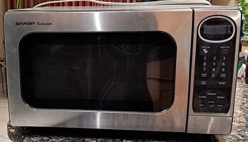 Микроволновая печь Sharp мощностью 1100 Вт, модель R-305KS, нержавеющая сталь.